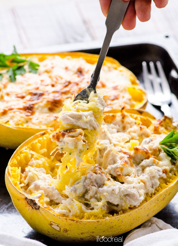 holding-greek-yogurt-chicken-alfredo-spaghetti-squash-boats-recipe