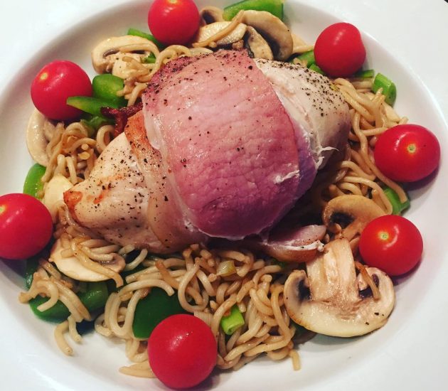 chickenwrappedinbaconmedallionsservedwithwholemealnoodlesandmixedvegetables